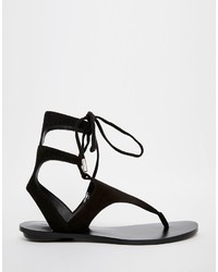 schwarze flache Sandalen aus Wildleder