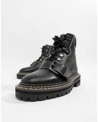 schwarze flache Stiefel mit einer Schnürung aus Leder von ASOS DESIGN
