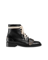 schwarze flache Stiefel mit einer Schnürung aus Leder von Gucci
