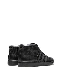 schwarze hohe Sneakers aus Leder mit Schlangenmuster von adidas