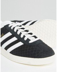 schwarze hohe Sneakers mit Schlangenmuster von adidas