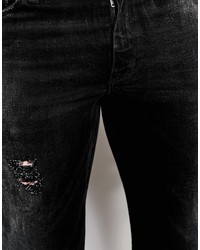 schwarze Jeans mit Destroyed-Effekten von Asos