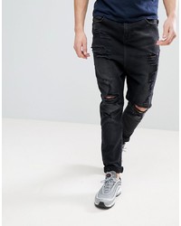 schwarze Jeans mit Destroyed-Effekten von ASOS DESIGN