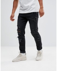 schwarze Jeans mit Destroyed-Effekten von ASOS DESIGN