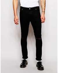 schwarze Jeans mit Destroyed-Effekten von Asos