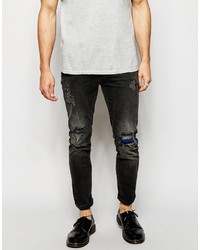 schwarze Jeans mit Destroyed-Effekten von Asos