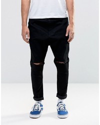 schwarze Jeans mit Destroyed-Effekten von Asos