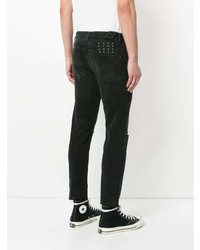 schwarze Jeans mit Destroyed-Effekten von Ksubi