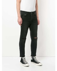 schwarze Jeans mit Destroyed-Effekten von Ksubi