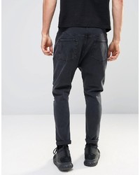 schwarze Jeans mit Destroyed-Effekten von Asos