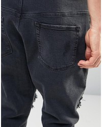 schwarze Jeans mit Destroyed-Effekten von Asos