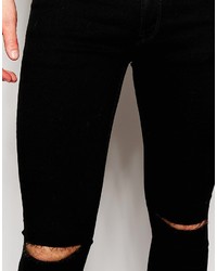 schwarze Jeans mit Destroyed-Effekten von Asos