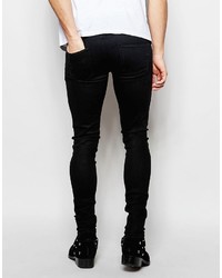 schwarze Jeans mit Destroyed-Effekten von Asos