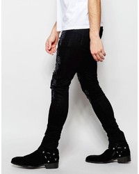 schwarze Jeans mit Destroyed-Effekten von Asos