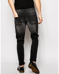 schwarze Jeans mit Destroyed-Effekten von Asos