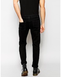 schwarze Jeans mit Destroyed-Effekten von Asos