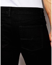 schwarze Jeans mit Destroyed-Effekten von Asos