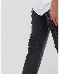 schwarze Jeans mit Destroyed-Effekten von Asos