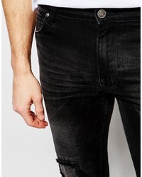 schwarze Jeans mit Destroyed-Effekten von Asos