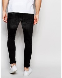 schwarze Jeans mit Destroyed-Effekten von Asos