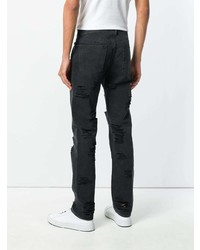 schwarze Jeans mit Destroyed-Effekten von Diesel