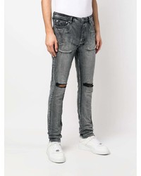 schwarze Jeans mit Destroyed-Effekten von Ksubi