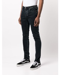 schwarze Jeans mit Destroyed-Effekten von Ksubi