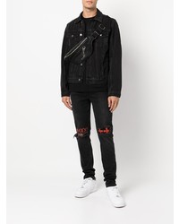 schwarze Jeans mit Destroyed-Effekten von Ksubi