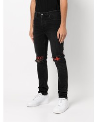 schwarze Jeans mit Destroyed-Effekten von Ksubi