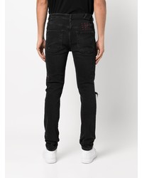 schwarze Jeans mit Destroyed-Effekten von Ksubi