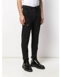 schwarze Jeans mit Destroyed-Effekten von Thom Krom