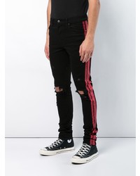 schwarze Jeans mit Destroyed-Effekten von Amiri