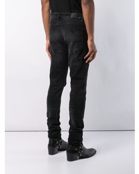 schwarze Jeans mit Destroyed-Effekten von Amiri