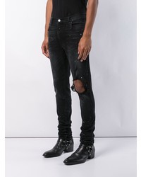 schwarze Jeans mit Destroyed-Effekten von Amiri