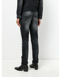 schwarze Jeans mit Destroyed-Effekten von Saint Laurent