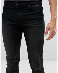 schwarze Jeans mit Destroyed-Effekten von Cheap Monday