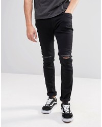 schwarze Jeans mit Destroyed-Effekten