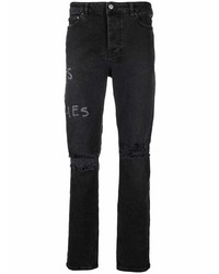 schwarze Jeans mit Destroyed-Effekten von Ksubi