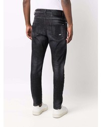 schwarze Jeans mit Destroyed-Effekten von John Richmond