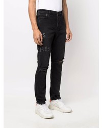 schwarze Jeans mit Destroyed-Effekten von Ksubi