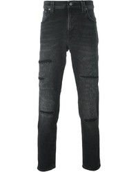 schwarze Jeans mit Destroyed-Effekten von Nudie Jeans