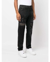 schwarze Jeans mit Destroyed-Effekten von Palm Angels