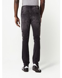 schwarze Jeans mit Destroyed-Effekten von Ksubi