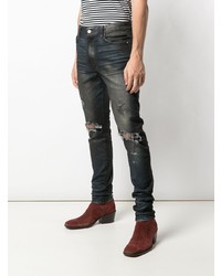 schwarze Jeans mit Destroyed-Effekten von Amiri