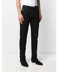 schwarze Jeans mit Destroyed-Effekten von Balmain