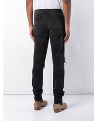 schwarze Jeans mit Destroyed-Effekten von Amiri