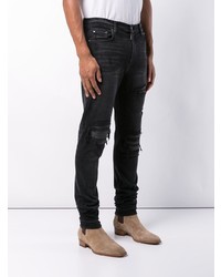 schwarze Jeans mit Destroyed-Effekten von Amiri