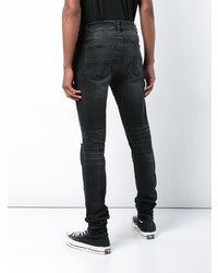 schwarze Jeans mit Destroyed-Effekten von Amiri