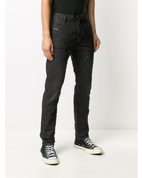 schwarze Jeans mit Destroyed-Effekten von Diesel