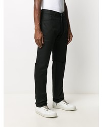 schwarze Jeans mit Destroyed-Effekten von Raf Simons